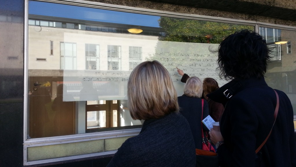 Rosemary and Rebecca inspecting Abi Spendlove's tapestry